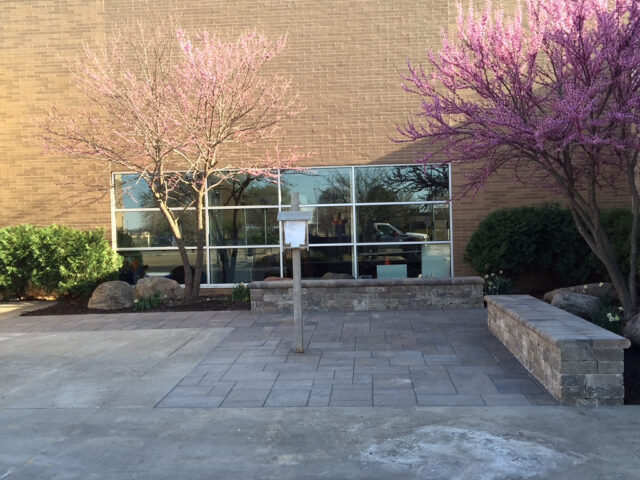 brick stone benches and stone stamped concrete by commercial building