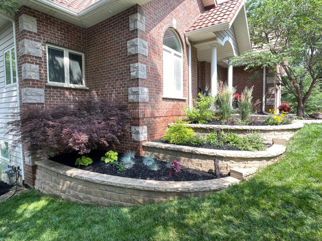 layers of retaining walls with stone bricks and plants
