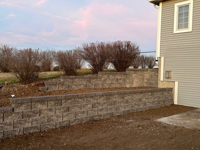 retaining walls by residential home backyard