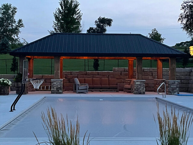 large stone gazebo by pool