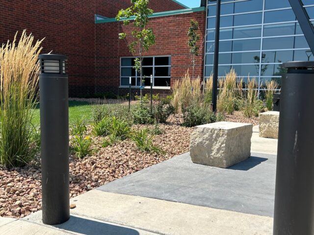 stone and plant landscape around building